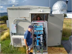 Professor Clark Wilson and Graduate student Chris Linick install the gravimeter.